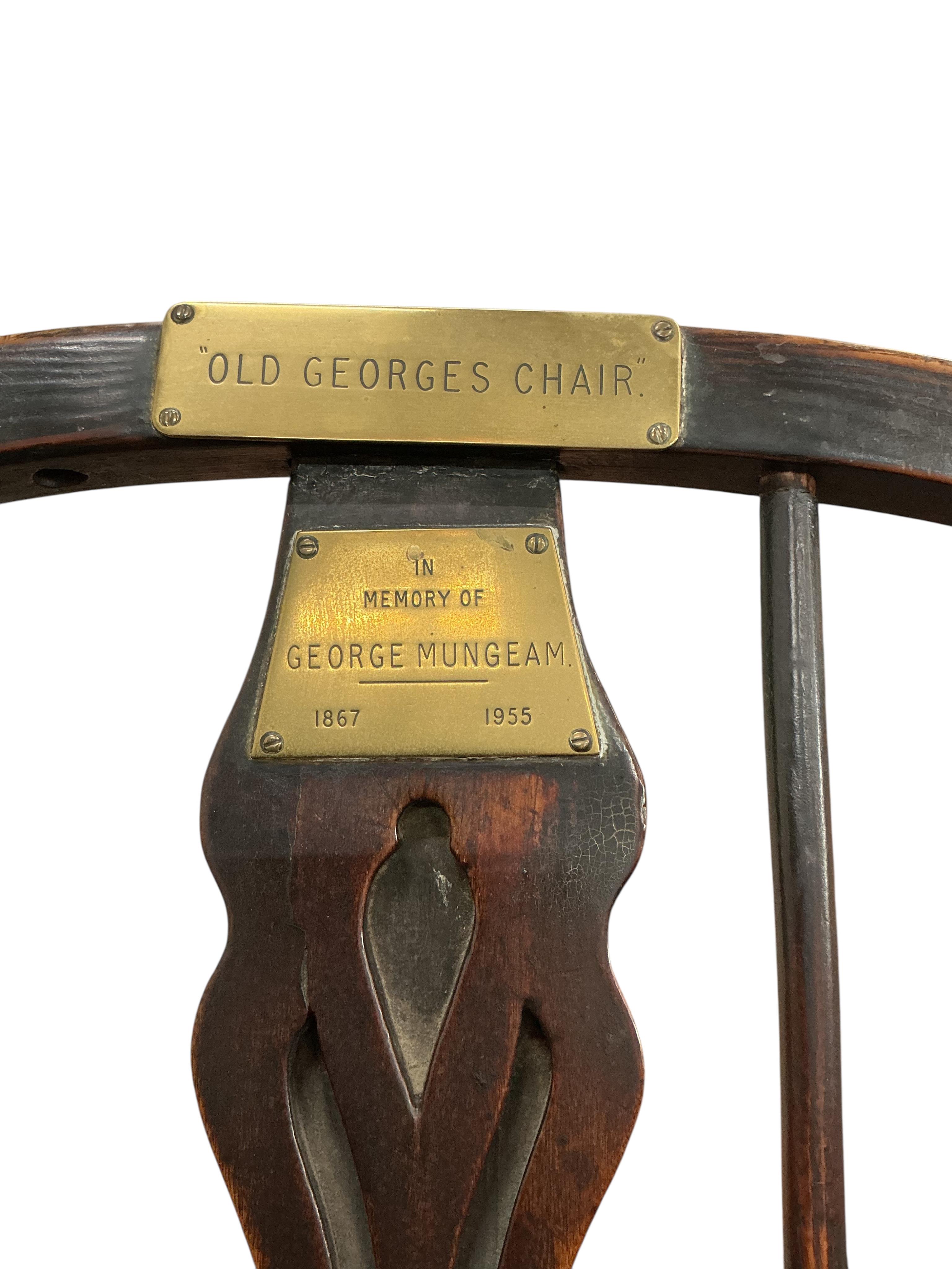 A Victorian ash and elm Windsor armchair, with brass commemorative plaques 'Old George's Chair', width 56cm, depth 46cm, height 102cm